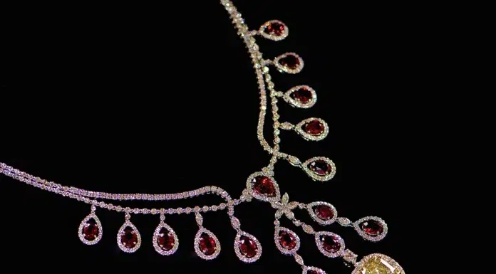 Inside Carrie Underwood’s 48-Carat Firefly Diamond Necklace Johnathon Arndt, Carrie Underwood - The Heartbeat Ruby Necklace with the Firefly Yellow Diamond