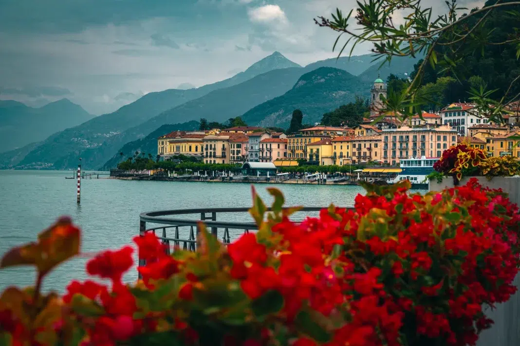 Stunning flowery waterfront of Lake Como near Bellagio, Lombardy, Italy. Photo via vecteezy