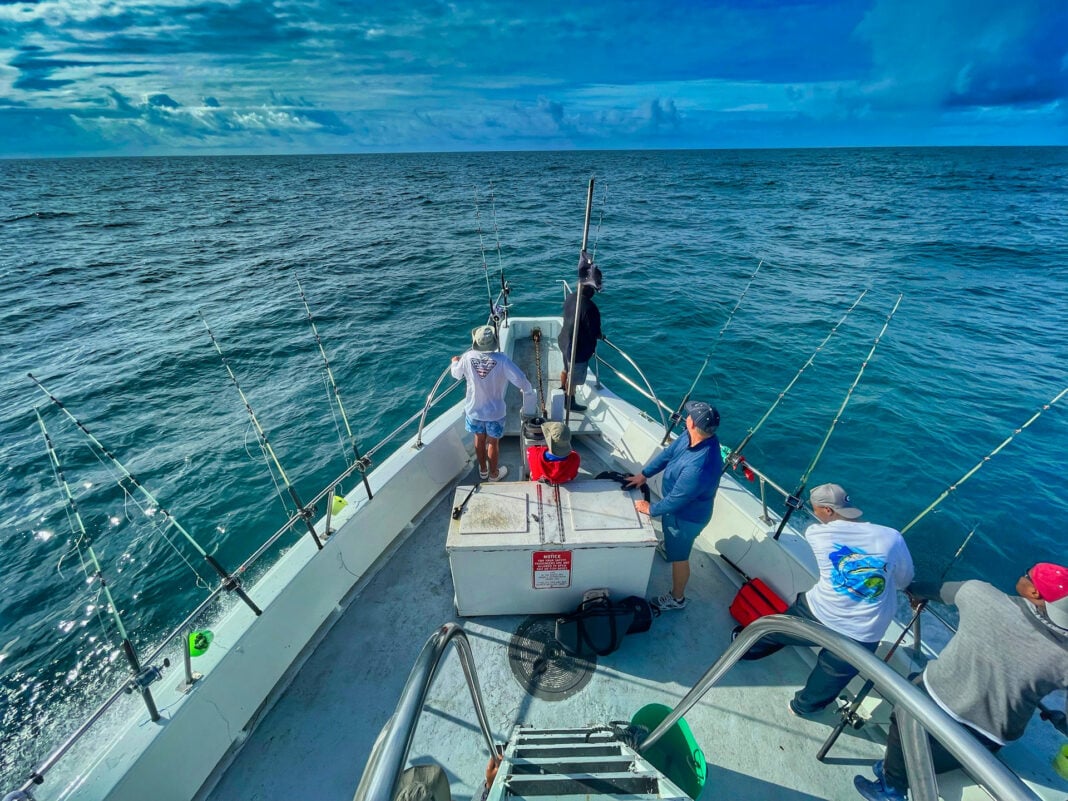 Fishing Boat with a lot of people fishing. Photo by Gene Gallin via unsplash