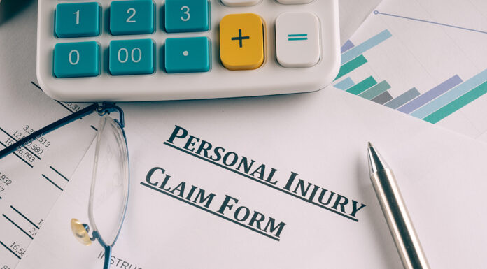 How to file a personal injury claim if you were involved in a car accident personal injury claim form on desk. Photo courtesy of Adobe Free Stock Images