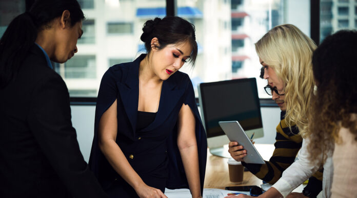 5 Reasons a Skillful Concierge is So Vital for Luxury Travel Skillful Concierge assisting people with travel destinations. Photo via Adobe Free Stock Images