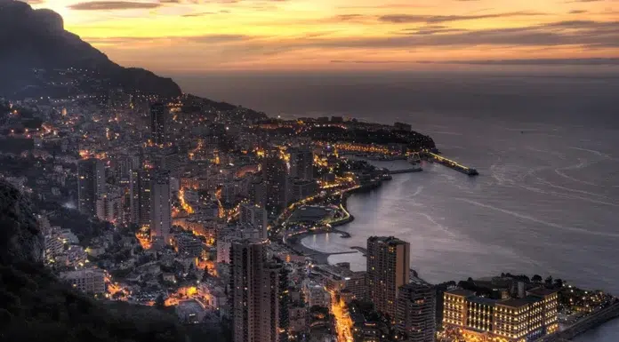 Strong Demand Continues to Drive Up Monaco Property Prices serene-dusk-over-mountains-and-real estate buildings-beneath-a-cloudy-sky_in Monaco