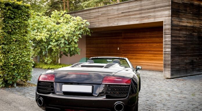 Three Reasons as to Why You Should Rent a Luxury Car Luxury sports car in front of a garage