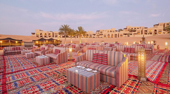 Abu Dhabi Travel Guide: Beaches, City Life & Desert Luxury Al Falaj, a Bedouin-style dining experience set among the dunes