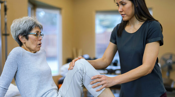 An In-depth Look At A Rehabilitation Center A lady working at a rehabilitation center with her patient. Photo by Getty Images via Unsplash