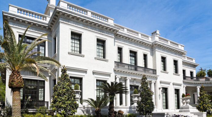 Tips for Improving Your Home’s Facade home facade improvement with beautiful landscaping. Photo via adobe free stock