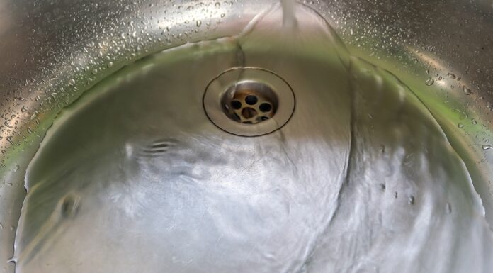 6 Simple (Yet Effective) Ways To Unclog Drains running water on an unclog drain