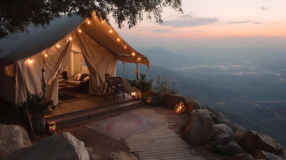 Cozy glamping tent on a mountaintop providing a luxurious retreat with stunning panoramic views