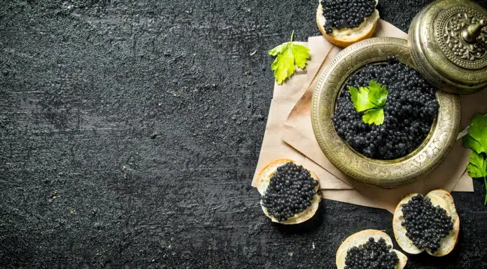Osetra, Elevated: Italy’s Quiet Mastery of Caviar A bowl with premium Caviar on bread slices. Photo via medium-vecteezy