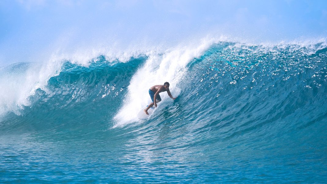 Surfing is a non contact sports for beginners. Photo via adobe free stock images