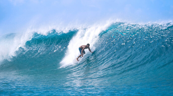 6 Non-Contact Sports That are Perfect for Beginners Surfing is a non contact sports for beginners. Photo via adobe free stock images