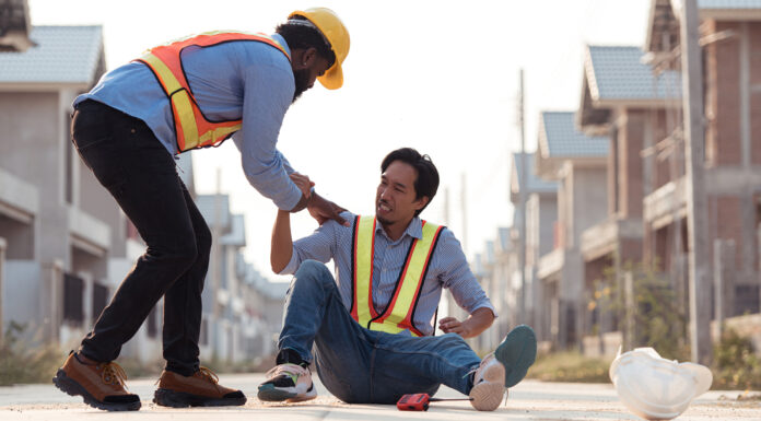 Construction Accident, Should You File a Workers Comp or Personal Injury Claim Coworkers provided first aid to a worker who had an accident on