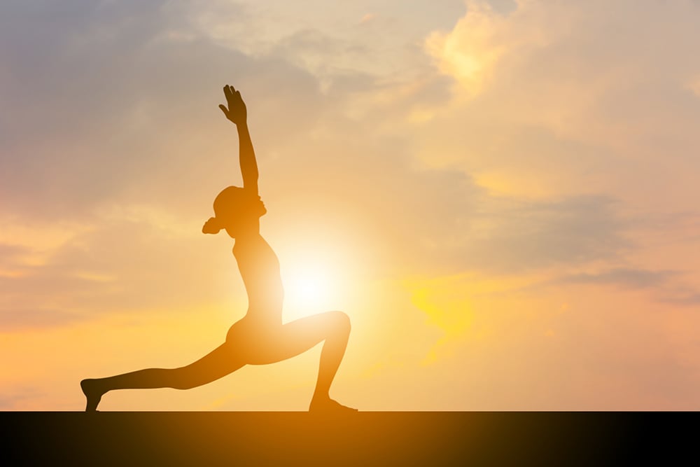 Silhouette of young woman with clipping path practicing yoga relaxing exercise at sunset, Freedom and relax concepts.
