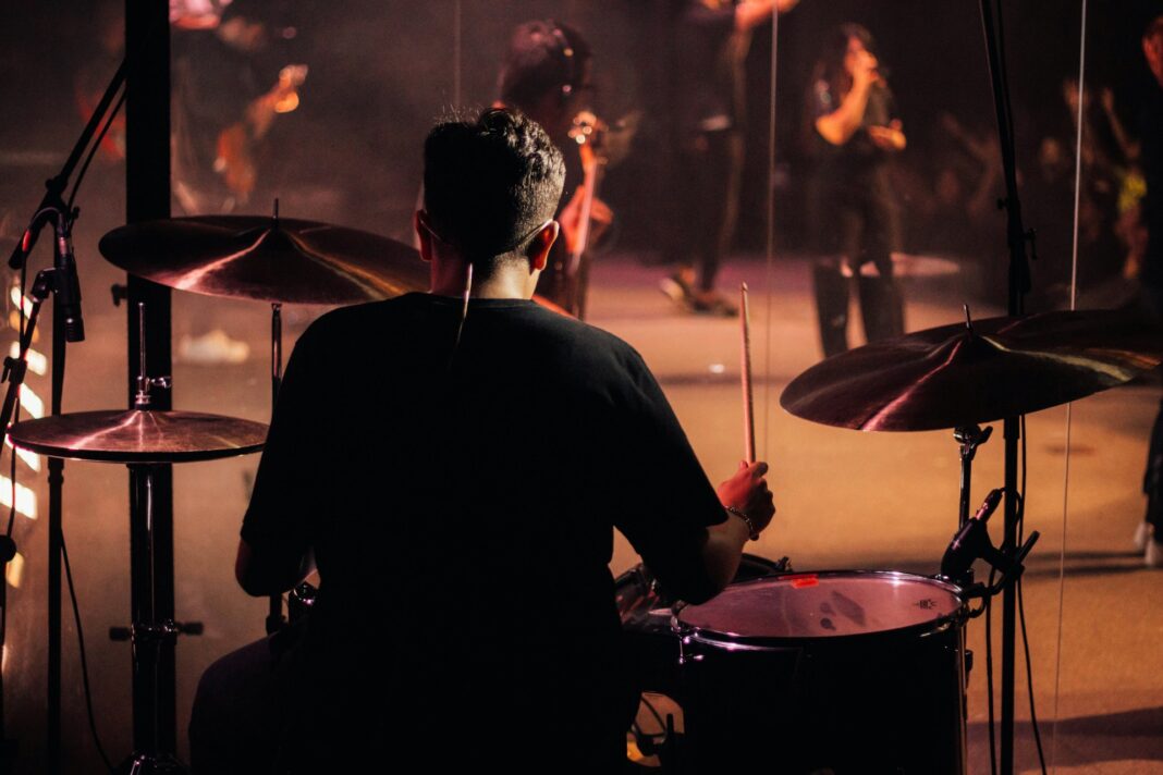 Playing Drum. Photo by Rafael Oliveira via unsplash