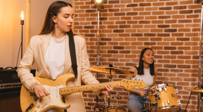 How To Choose The Right Musical Instrument To Study Playing the guitar, a musical instrument. Photo by Antoni Shraba via pexels