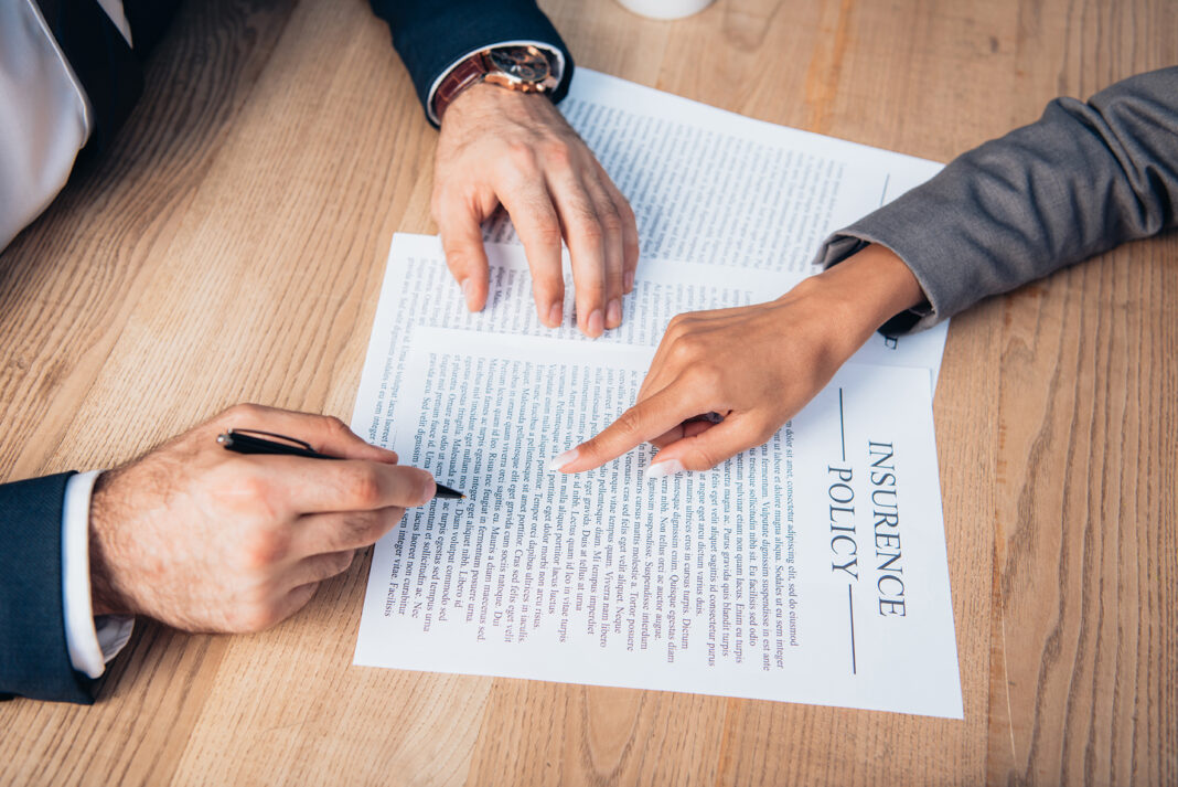 Insurance Policy review. Photo by lightfield studios via adobe