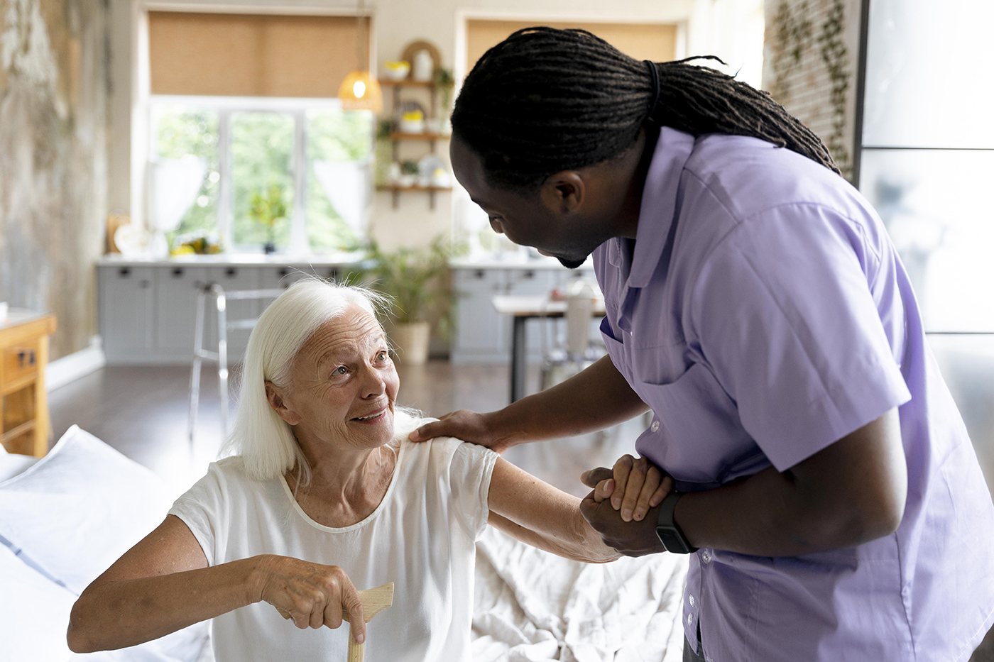 care giver taking care of an old woman. Photo via freepik