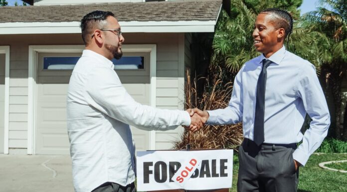Understanding The Responsibilities Of A Real Estate Agent Real Estate Agent with his customer. Photo via Pexels by Kindelmedia