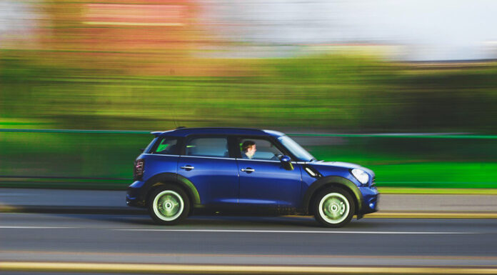 Staying Safe on the Roads: 5 Driving Tips for Modern Technology driving a car on the road