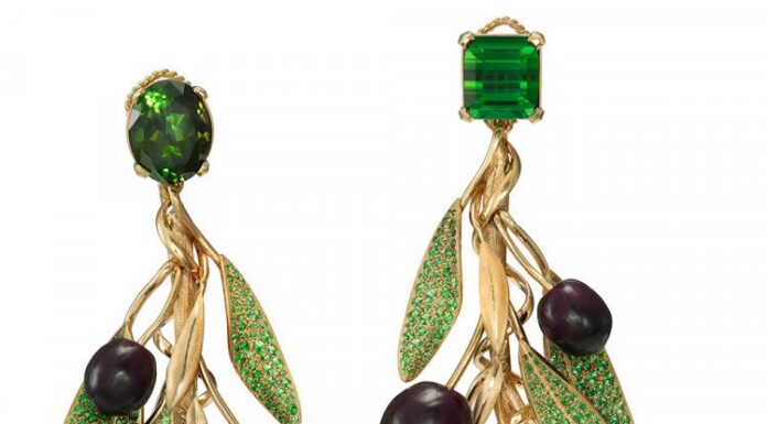 The meticulous craftsmanship Earrings in yellow gold with green tourmalines, emeralds and tsavorite garnets. Courtesy of Dolce & Gabbana.