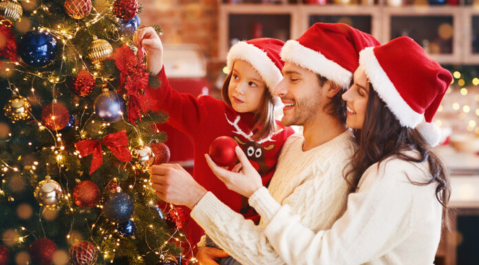 How to Plan Christmas on a Budget Frugal Christmas planning with family. Photo by Prostock-studio