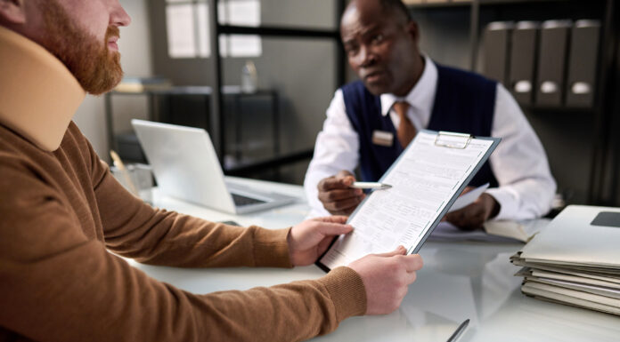 7 Reasons To Hire An Injury Attorney When Claiming Compensation Injury Attorney with his client