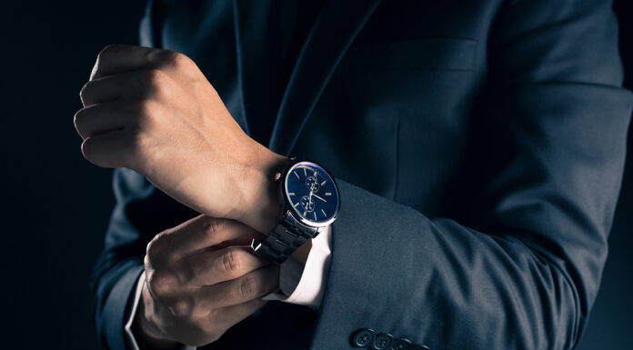 How To Value Your Watch Accurately Businessman checking time from watch