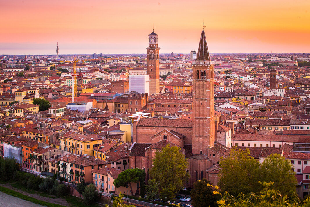 Aerial view of Verona city night cityscape and Church Santa Anas in Northern Italy