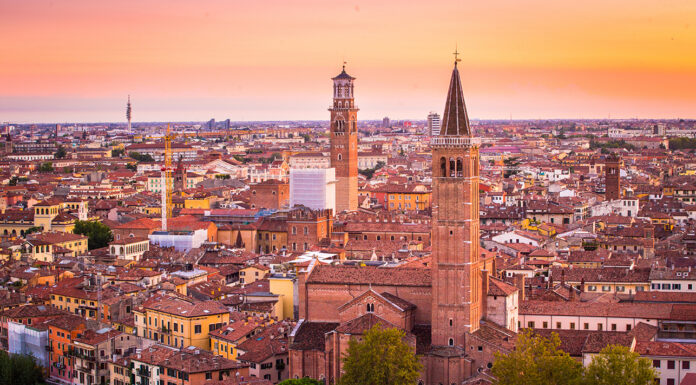 Top 9 Must-See Attractions on Your Northern Italy Tours Adventure Aerial view of Verona city night cityscape and Church Santa Anas in Northern Italy