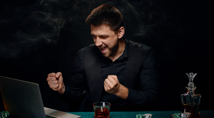 Tips & Tricks to Get Better at Online Casino Games Bearded online casino player man celebrating victory