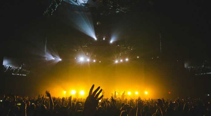 From Stadium Spectacles to Intimate Gigs: Concert Ideas for Music Lovers Concert full of people enjoying themselves. Photo by Nainoa Shizuru via Unsplash