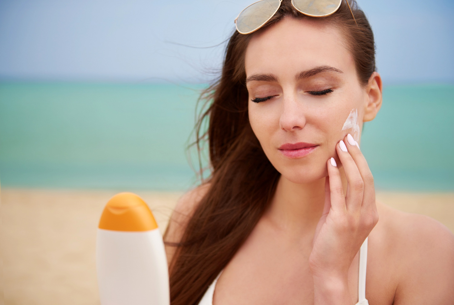 Woman applying sunscreen on her face. Image by gpointstudio on Freepik Woman applying sunscreen on her face. Image by gpointstudio on Freepik