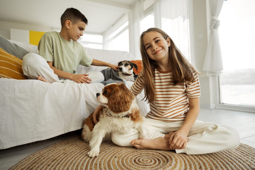 cousins-spending-time-together-home-with-pet-dog. Photo via Freepik free