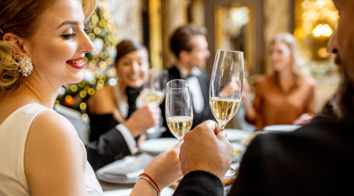 The Lost Art of Throwing a Dinner Party: A How-to Guide Hosting a dinner party at home. Photo via Adobe Free Stock Images