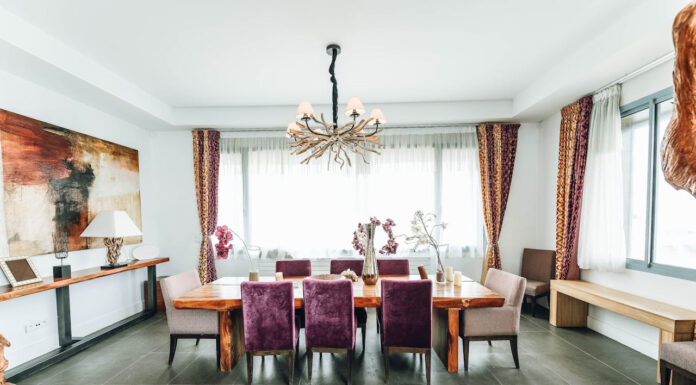 How to Find the Perfect Statement Piece Chandelier for Your Dining Room Beautiful chandelier placed over the dining room. Photo by Zak Chapman via pexels
