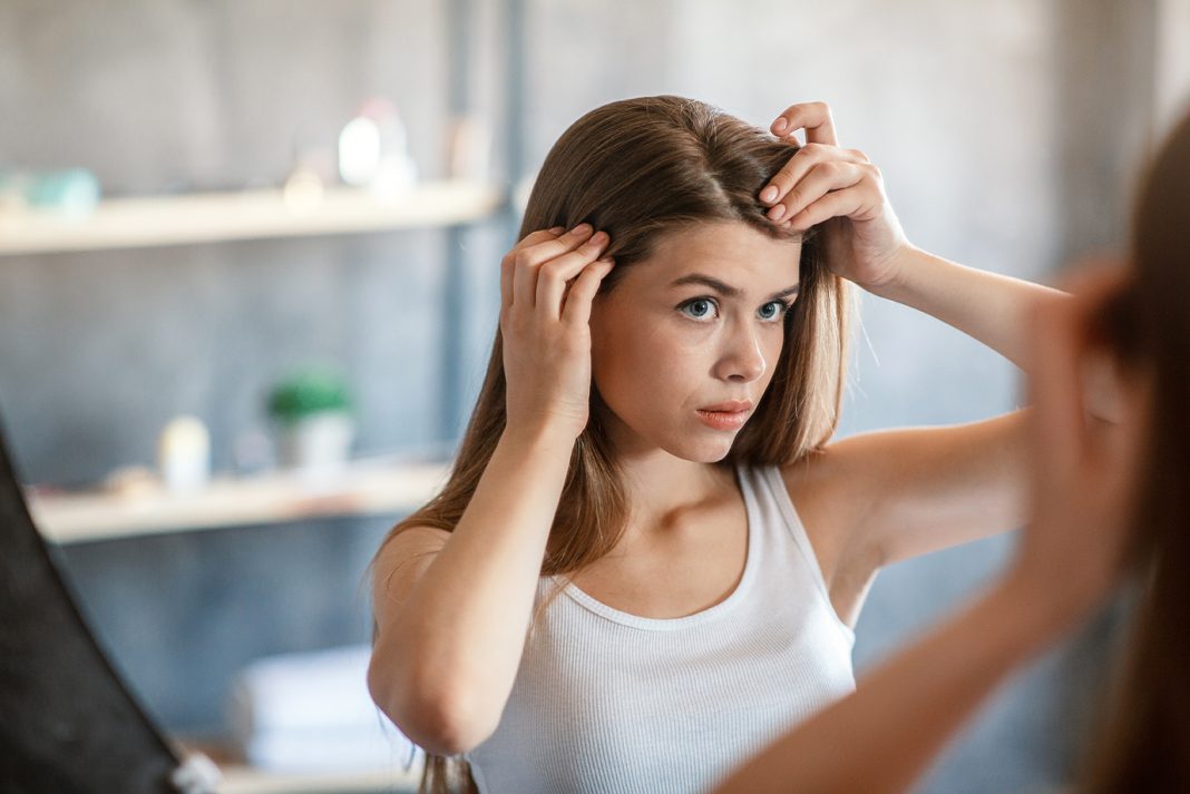 Pretty girl with lice. Photo via Adobe Free Stock Images