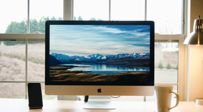 Is your Mac stuck while getting updates? Find the best solutions here! Mac computer. Photo via Patrick Ward via unsplash