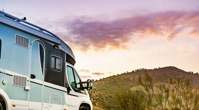 How to Travel in Comfort with Your Caravan This Season? Rv camper camping on nature, Spain.