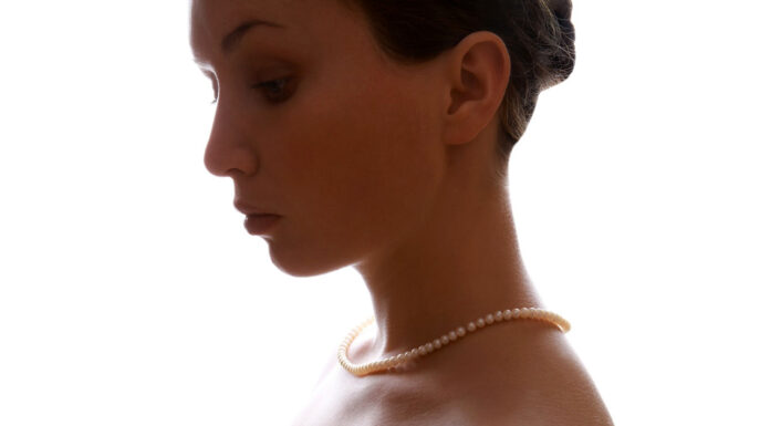 How to Say Goodbye to Unwanted Neck Fat? woman wearing a pearl necklace without any neck fat. Photo by Nika Akin from pixabay