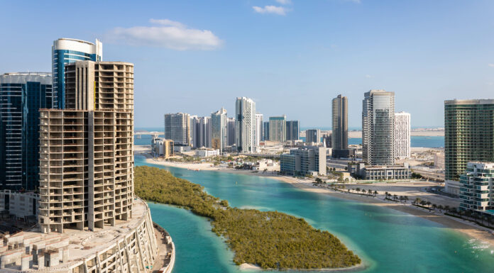 Is Abu Dhabi a Good Place to Invest in Off-Plan Properties From the US? Aerial view of Reem Island in Abu Dhabi with mangrove trees and