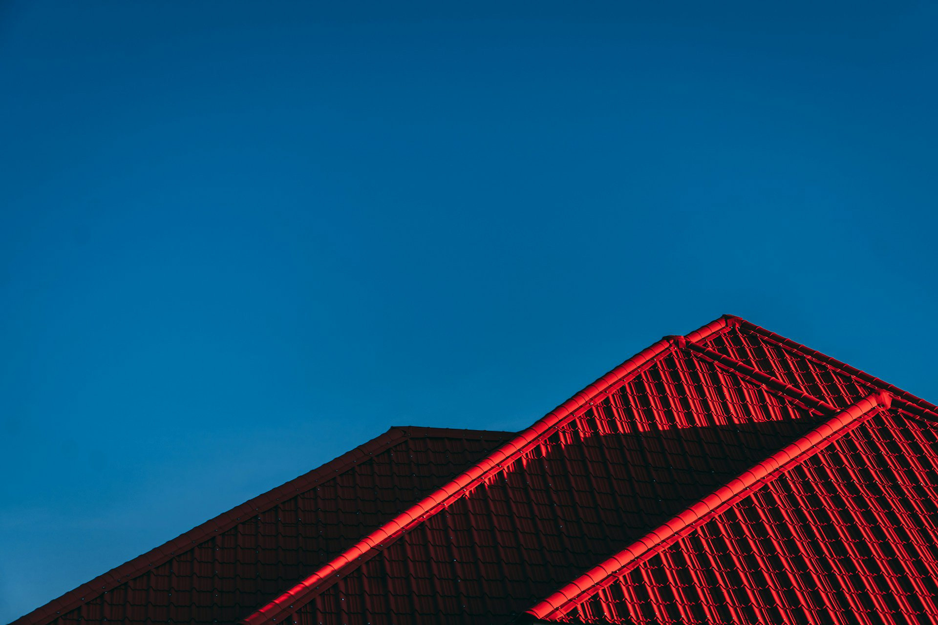 Red roof. Photo by Robin Kutesa via unsplash