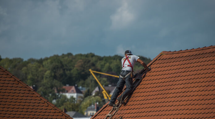 How to Choose the Right Roofing Contractor: Tips and Tricks Roofer contractor working on a house's roof. PHoto by Mario Ohibsky from pixabay