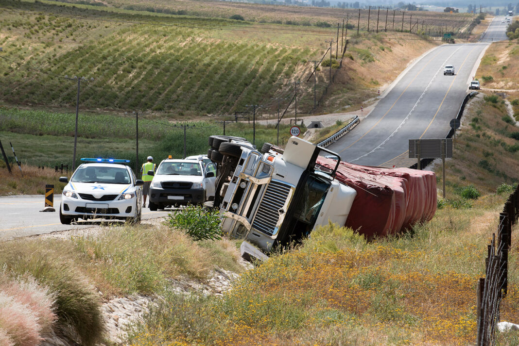 Overturned truck accident on the freeway. Photo by adobe free stock images