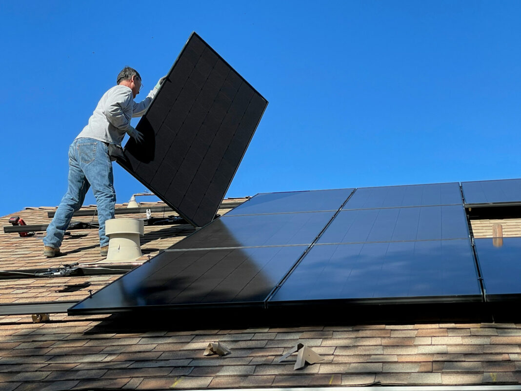 Solar panels on a roof of a house. Photo by Bill Mead via unsplash