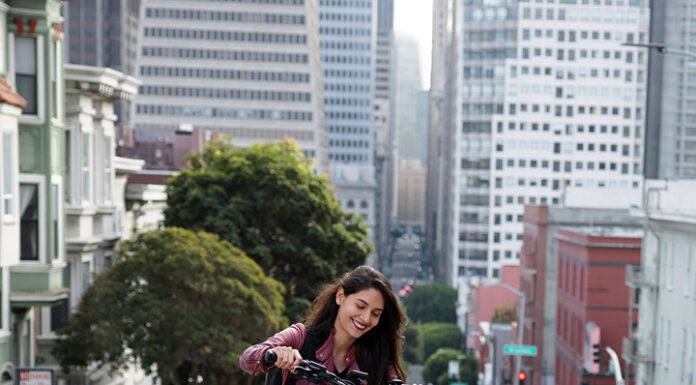 Why You Should Consider an E-Bike for Your Next Purchase A lady driving an E-Bike. Photo by u_d7hddm5o from pixabay