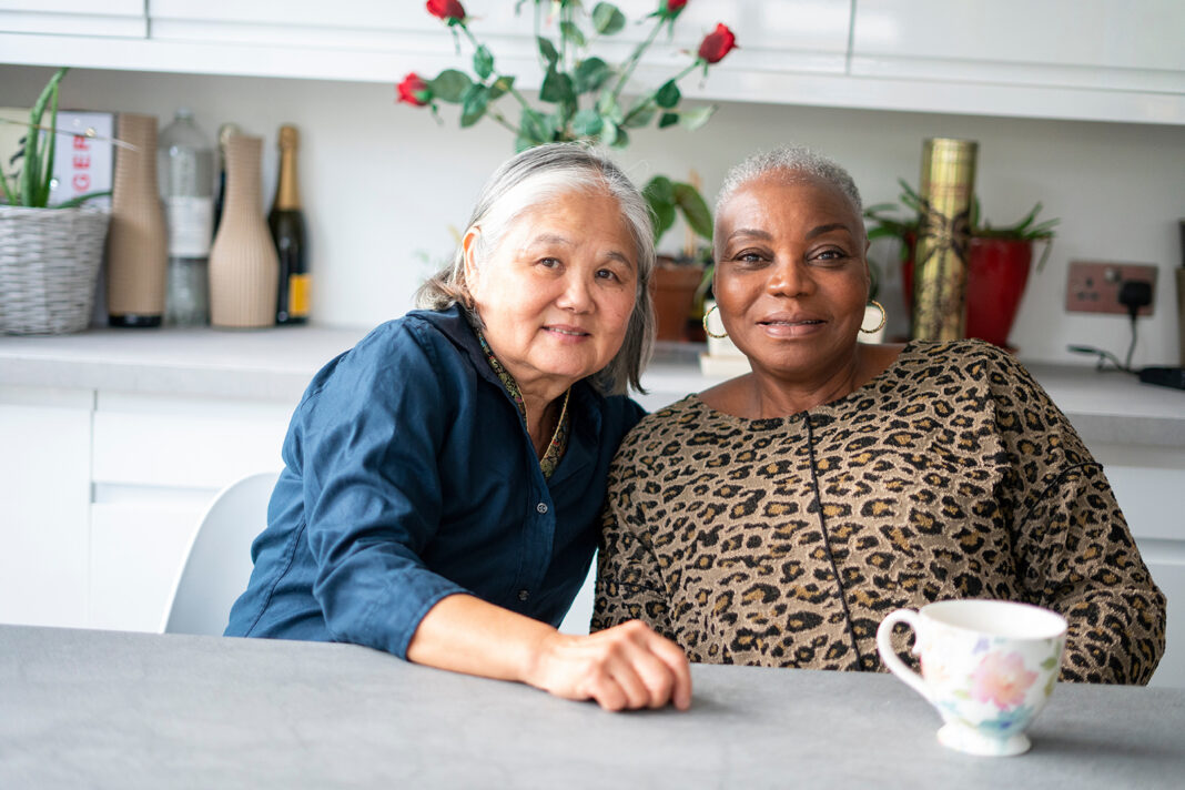 Portrait of two senior women at home. Photo by adobe