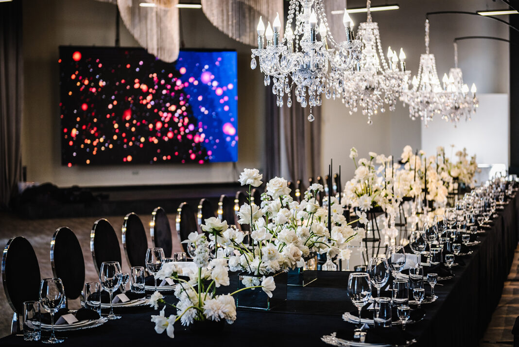 Luxury wedding reception. Trendy decor large chandelier. Photo by Adobe Free stock Luxury wedding reception. Trendy decor large chandelier. Photo by Adobe Free stock