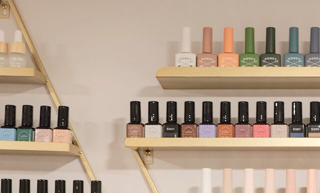 Behind the Bottle: The Fascinating Process of Nail Polish Manufacturing Nail Polish bottles. Photo by Henry & Co via unsplash