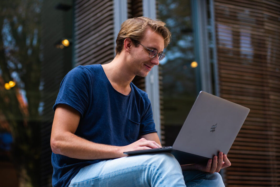 Working on an efficient laptop. Photo by Buro Millennial via pexels