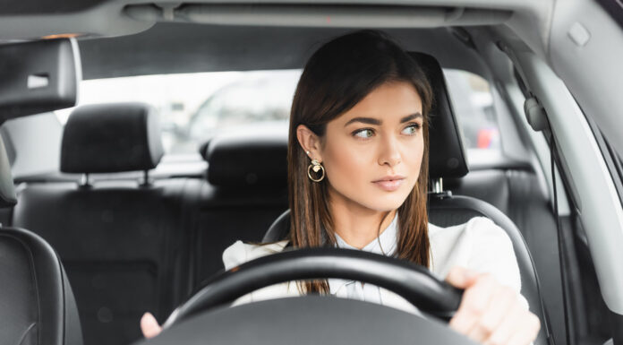 How to Improve Your Situational Awareness While Driving A woman driving paying attention to her surroundings. Photo by Lightfield Studios via adobe